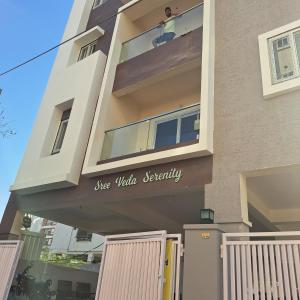 a building with a sign that reads she wolf security at Jhanu's Home 1 in Gundipet