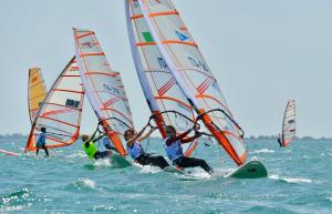 a group of people windsurfing in the ocean at Marine Pearl in Marina Julia