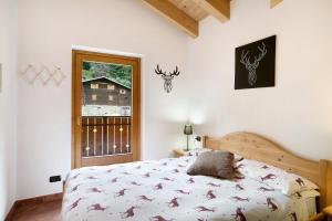 Ένα ή περισσότερα κρεβάτια σε δωμάτιο στο Casa Michela Trilocale Mansardato