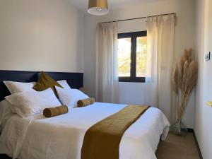 Ένα ή περισσότερα κρεβάτια σε δωμάτιο στο Villas Pampa - Logements de vacances