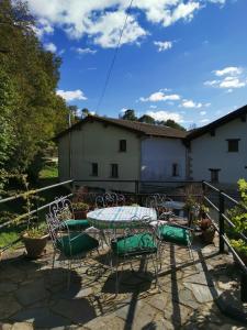 a patio with a table and chairs on a patio at GURE TXOKO Casa Rural in Odériz