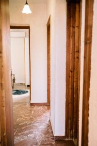 a flooded hallway with water pouring into a room at LaPlayaSuites 1st in Periyiálion +21 photos