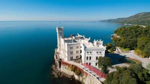 a castle on the edge of a body of water at Marine Pearl in Marina Julia