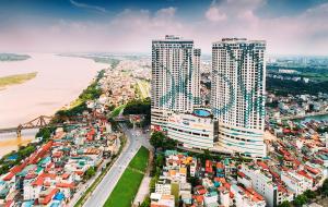 an aerial view of a city with tall buildings at Emoi Mipec Riverside's Apt in Hanoi