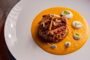 a plate of food on a white plate at Best Western Plus Sabaudia Hotel in Sabaudia
