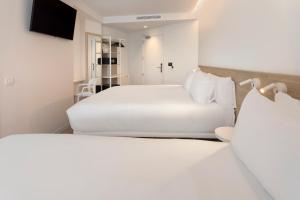 B&B HOTEL Alicante Centro客房内的一张或多张床位