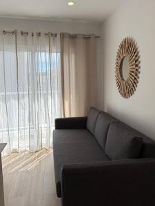 Et opholdsområde på Playa Chica Luxury Apartament + 19 billeder