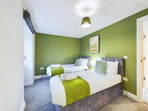 Ένα ή περισσότερα κρεβάτια σε δωμάτιο στο Newquay Entire House Fistral Beach