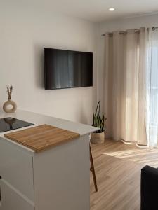 Et tv og/eller underholdning på Playa Chica Luxury Apartament