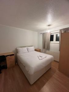 Ένα ή περισσότερα κρεβάτια σε δωμάτιο στο Norwich Home