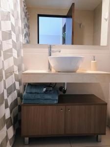 Ένα μπάνιο στο GALA Dptos. Temp. Condominios del Alto