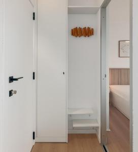 Ένα ή περισσότερα κρεβάτια σε δωμάτιο στο Les Voiliers 17