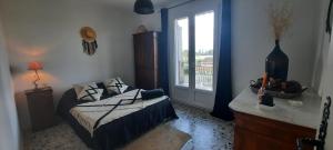 Ένα ή περισσότερα κρεβάτια σε δωμάτιο στο Villa les 4 vents