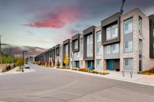 an empty street with a row of apartment buildings at My Sweet Rentals- 30 night min in Aurora