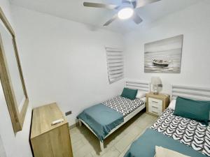 Ένα ή περισσότερα κρεβάτια σε δωμάτιο στο Juana +31 φωτογραφίες