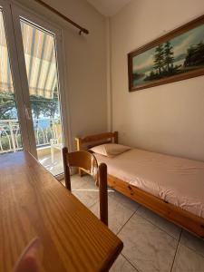 Posteľ alebo postele v izbe v ubytovaní Tsatsalmas Rooms with sea View