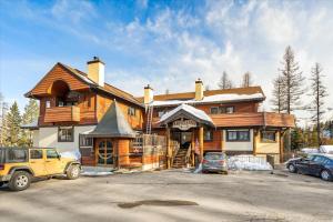 a house is being built in a parking lot at Cozy Ski-In Ski-Out Big Mountain Condo in Whitefish +21 photos