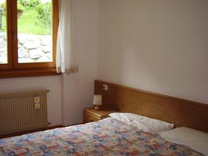 Postel nebo postele na pokoji v ubytování Residenza Al Castello