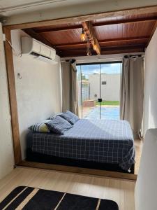Ένα ή περισσότερα κρεβάτια σε δωμάτιο στο Casa de temporada container 1,5 Km da Praca +76 φωτογραφίες