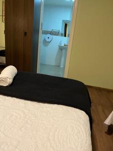 Postel nebo postele na pokoji v ubytování Hotel Nova Vida + 1 fotografie