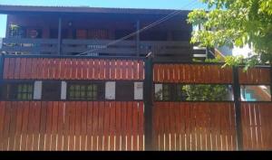an orange fence with a building in the background at Depto Villa Gesell in Villa Gesell