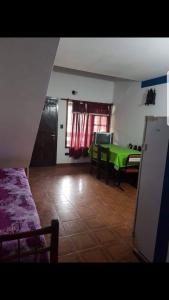 a living room with a green ping pong table at Depto Villa Gesell in Villa Gesell