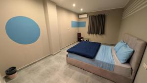 A bed or beds in a room at Bedcoin Hostel