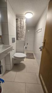 Koupelna v ubytování Muhusin Apartments Trimbach + 27 fotografií