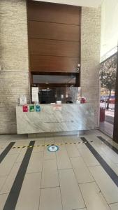 a lobby with a counter in a building at Pauwla in Santiago