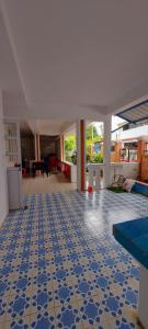a room with a blue and white tiled floor at Tamarin Beach House in Tamarin