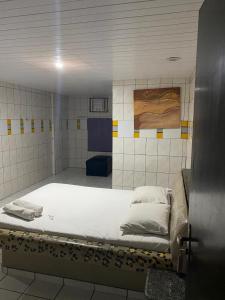 Ένα ή περισσότερα κρεβάτια σε δωμάτιο στο Hotel Extasy Brotas