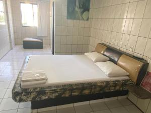 Ένα ή περισσότερα κρεβάτια σε δωμάτιο στο Hotel Extasy Brotas