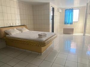 Ένα ή περισσότερα κρεβάτια σε δωμάτιο στο Hotel Extasy Brotas