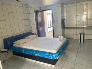 Ένα ή περισσότερα κρεβάτια σε δωμάτιο στο Hotel Extasy Brotas