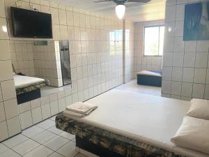 Ένα ή περισσότερα κρεβάτια σε δωμάτιο στο Hotel Extasy Brotas