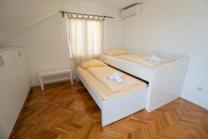 Postel nebo postele na pokoji v ubytování Villa Tia