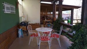 a table and four chairs on a patio at La Traviesa in Soneja +14 photos