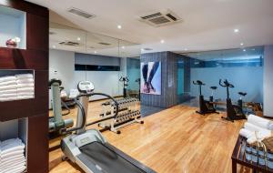a gym with treadmills and exercise equipment in a room at Hotel Sercotel Ciutat D'Alcoi in Alcoy