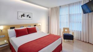 Postel nebo postele na pokoji v ubytování Sercotel Caspe
