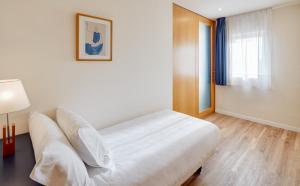 Posteľ alebo postele v izbe v ubytovaní Sercotel Arrahona Sabadell