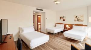Posteľ alebo postele v izbe v ubytovaní Sercotel Arrahona Sabadell