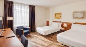 Posteľ alebo postele v izbe v ubytovaní Sercotel Arrahona Sabadell