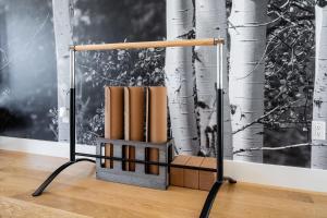 a book stand with books in front of a wall at Your Downtown Urban Sanctuary - Walk to EVERYTHING in Bozeman