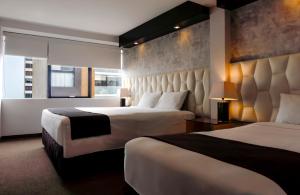 Katil atau katil-katil dalam bilik di Hotel Ferré Miraflores