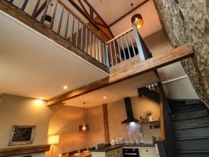 a staircase in a house with a stone wall at Ash Cottage in Barnard Castle +16 photos