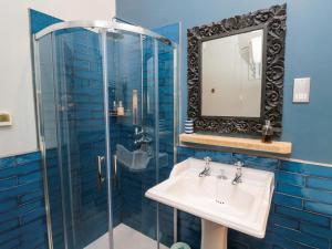 a bathroom with a sink and a mirror at Ash Cottage in Barnard Castle