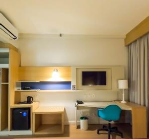 Stay Inn Santos Sua acomodação com cara de Hotel的电视和/或娱乐中心