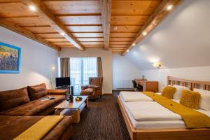 A bed or beds in a room at Boutique Hotel Vila Lieska