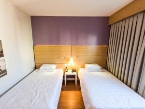 Stay Inn Santos Sua acomodação com cara de Hotel客房内的一张或多张床位