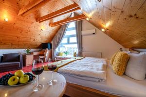 A bed or beds in a room at Boutique Hotel Vila Lieska